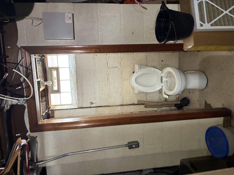 Responded to electrical hazard involving bathroom light fixture that was delivering shocks to occupant and failing to turn off via wall switch. Upon arrival, confirmed fixture was de-energized at breaker panel for safety. Inspected fixture wiring and switch connections, identified faulty fixture with compromised insulation causing electrical leakage. Removed defective light fixture, verified circuit integrity, installed replacement fixture with proper grounding, and tested all switching functions to ensure safe operation before restoring power at panel.