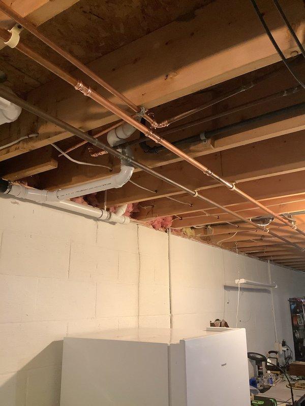 Upon arrival, conducted a comprehensive basement plumbing inspection and identified multiple concerns requiring immediate attention. Discovered eight corroded SharkBite fittings throughout the basement plumbing system, presenting potential failure points in the water distribution infrastructure. Evaluated the whole home shutoff valve and determined replacement was necessary to ensure proper water supply control and system integrity.

Assessed shutoff valves serving both front and outdoor spigots and recommended complete replacement including installation of new sillcocks to provide reliable exterior water access and prevent future leaks. Documented existing copper and PVC piping configuration in the unfinished basement area, noting the various supply and drainage lines mounted to ceiling joists.

Provided the homeowner with comprehensive repair options addressing all identified issues, including individual component repairs and a complete system upgrade package. Explained that replacem