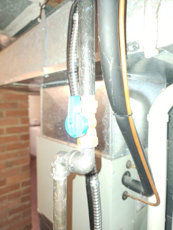 Completed full HVAC system installation including 80% AFUE furnace and air conditioning unit in basement utility area. Installed new air handler with proper electrical connections and junction box wiring. Ran refrigerant lines with appropriate insulation wrapping from condensing unit to air handler. Installed PVC condensate drain piping with proper pitch and mounting brackets secured to wall framing. Connected flexible metal conduit for electrical service and mounted all components to manufacturer specifications. Routed metallic flexible ductwork for supply air distribution. System tested and operational upon completion.
