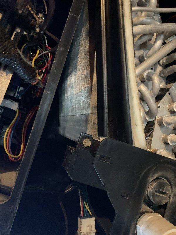 Completed scheduled maintenance visit on 12-year-old heat pump system. Inspected internal components including evaporator coil assembly, refrigerant lines, and electrical connections. Checked air filter condition at return air grille. All components found in operational condition with normal dust accumulation for system age. System operating within manufacturer specifications.