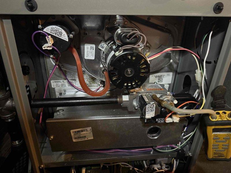 Performed comprehensive heating system maintenance and combustion analysis for MVP customer's final visit under current service agreement. Accessed and inspected all internal components including blower motor assembly, gas valve connections, and electrical wiring. Conducted combustion efficiency testing using calibrated gas analyzer, recording readings of 81.9% efficiency, 34 ppm CO, 9.0% O₂, and 6.7% CO₂, confirming unit is operating within acceptable parameters. All components found in good working condition with proper connections secured.