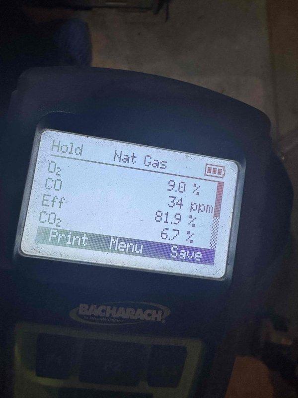 Performed comprehensive heating system maintenance and combustion analysis for MVP customer's final visit under current service agreement. Accessed and inspected all internal components including blower motor assembly, gas valve connections, and electrical wiring. Conducted combustion efficiency testing using calibrated gas analyzer, recording readings of 81.9% efficiency, 34 ppm CO, 9.0% O₂, and 6.7% CO₂, confirming unit is operating within acceptable parameters. All components found in good working condition with proper connections secured.