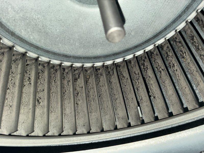 Completed comprehensive AC tune-up on 8-year-old system, including inspection of evaporator coil and blower assembly. Found significant dust accumulation on blower wheel and blades, along with visible corrosion and rust buildup around copper refrigerant line connections at evaporator coil; cleaned components and documented condition with photos for maintenance records. System operational upon completion of preventative maintenance service.