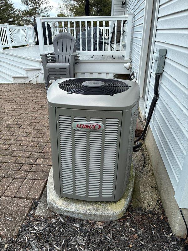 Completed routine MVP cooling maintenance visit on Lennox outdoor condensing unit. Performed comprehensive system inspection, verified unit operation, and documented equipment condition with photos showing unit positioned on concrete pad with proper clearances and adequate airflow access through side louvers and top-mounted fan assembly.