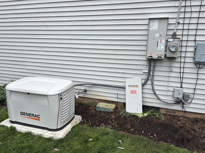 Completed installation of 22kW Generac whole home backup generator system with 150-amp automatic transfer switch. Mounted generator unit on concrete pad with proper clearances, installed transfer switch on exterior wall, and ran approximately 20 feet of gas line and electrical conduit to connect unit to existing utility services. Configured system for whole home backup coverage, performed startup procedures, and verified proper operation of automatic transfer functionality between utility and generator power sources.