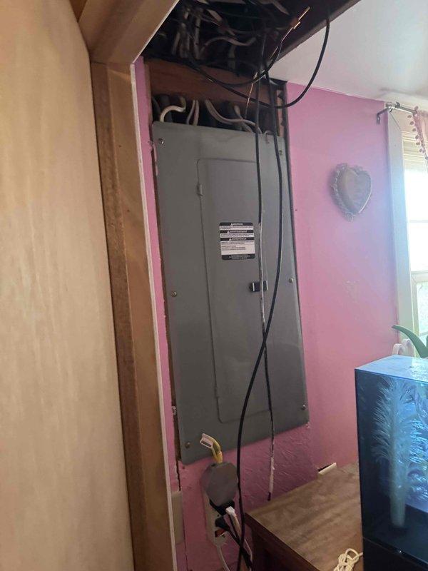 Completed installation of a 24 KW Generac standby generator with 200-amp automatic transfer switch at residential property. Installed generator unit on concrete pad adjacent to brick exterior wall with proper clearances maintained. Ran 15 feet of gas piping from existing gas line to generator unit, ensuring all connections met code requirements. Mounted transfer switch in interior location with appropriate electrical connections to main service panel and generator. Wired transfer switch to monitor utility power and automatically engage generator during power outages. All electrical conduit runs were secured to building exterior and routed to minimize exposure. Tested generator startup sequence, transfer switch operation, and verified proper load transfer between utility and generator power. System commissioned and confirmed operational for automatic backup power functionality.
