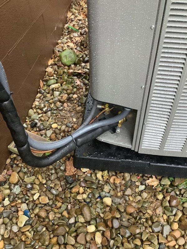 Completed installation of outdoor air conditioning condenser unit and matching evaporator coil as part of a secondary AC system installation. Unit was positioned on concrete pad with proper clearances, secured to manufacturer specifications, and connected to electrical disconnect box via conduit. Refrigerant lines were properly insulated and routed from the outdoor condenser to the indoor coil, with all connections brazed and pressure tested for leaks. System was evacuated, charged with refrigerant to manufacturer specifications, and tested for proper operation including airflow, temperature differential, and electrical draw verification. All installation met local code requirements and manufacturer guidelines for optimal performance.