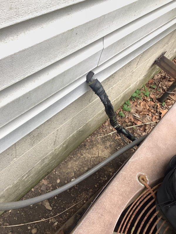 Conducted on-site evaluation for packaged HVAC unit replacement serving a medium-sized residential property with heating and cooling requirements. Assessed existing weathered packaged unit with cylindrical fan assembly, electrical disconnect box, and associated conduit routing along exterior wall. Documented current system configuration, equipment condition showing significant aging and wear, and provided comprehensive replacement estimate for natural gas or propane-fired packaged unit installation.