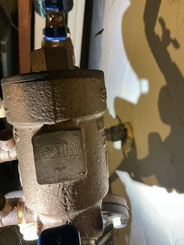 Completed annual backflow prevention device testing on residential property as first service call of the day. Tested and inspected BE316L backflow preventer assembly, verifying proper operation of check valves, test cocks, and relief valve in accordance with local plumbing codes and cross-connection control requirements. Documented water meter reading at 0110625 cubic feet on Neptune brand meter and confirmed system integrity with no leaks or anomalies detected during testing procedure.