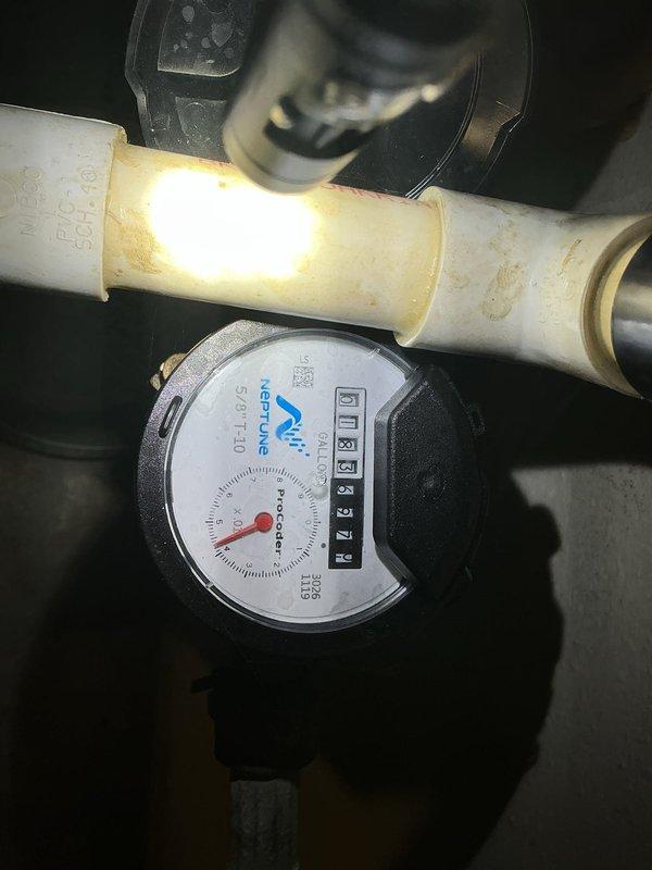 Completed annual backflow prevention device testing on residential property as first service call of the day. Tested and inspected BE316L backflow preventer assembly, verifying proper operation of check valves, test cocks, and relief valve in accordance with local plumbing codes and cross-connection control requirements. Documented water meter reading at 0110625 cubic feet on Neptune brand meter and confirmed system integrity with no leaks or anomalies detected during testing procedure.
