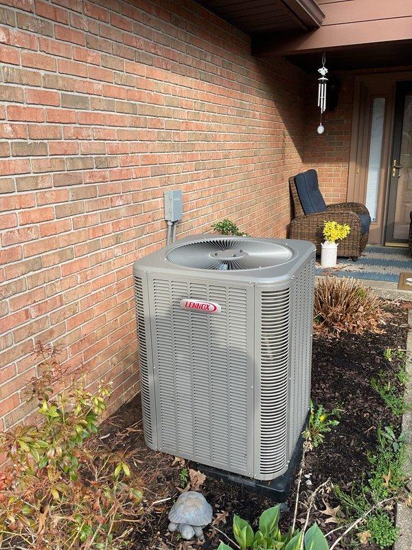 Performed scheduled air conditioning maintenance on residential Lennox condensing unit. Conducted comprehensive system inspection of outdoor unit, checking refrigerant levels, electrical connections, and overall component condition. Verified proper operation of condenser fan motor and compressor. Inspected electrical disconnect and conduit for secure connections and code compliance. Cleaned debris from surrounding area and confirmed unit placement on stable concrete pad with adequate clearance for airflow. System operating within normal parameters upon completion of maintenance service.