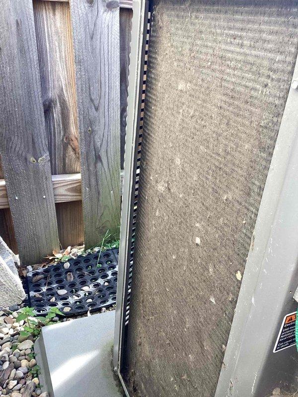 Performed comprehensive preventive maintenance tune-up on 10-11 year old residential air conditioning system. Inspected condenser unit exterior, noting significant debris accumulation on coil surfaces requiring attention. Completed standard seasonal maintenance procedures to prepare system for cooling season operation, documenting equipment condition through photographic documentation of outdoor unit installation and filter/coil surfaces showing heavy dirt buildup from extended service period.