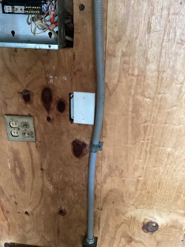 Completed comprehensive electrical safety upgrades and code compliance work throughout the residence. Installed duplex receptacle covers, single switch cover, and blank cover as needed. Mounted junction box on existing garage wall wiring that was previously exposed without proper enclosure. Separated ground and neutral conductors in attic subpanel to meet current NEC requirements and installed cover on previously open junction box. Installed two new GFCI Square D QO circuit breakers to protect bedroom circuits on upper level. Removed obsolete 240-volt receptacle located beneath garage electrical panel and properly blanked off the circuit opening.