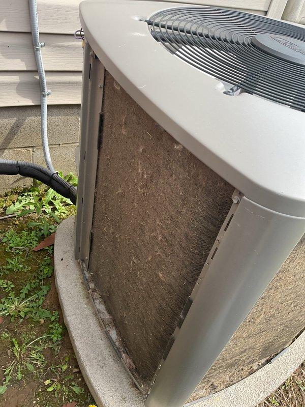 Completed routine maintenance on a five-year-old residential air conditioning system. Performed comprehensive inspection of outdoor condenser unit, cleaned heavily soiled exterior panels and coil fins to remove accumulated dirt and organic debris, checked refrigerant levels, tested electrical connections, verified proper fan operation, and confirmed system is operating within manufacturer specifications.