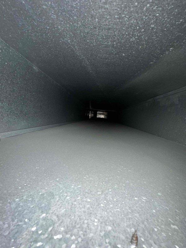 Completed comprehensive duct cleaning service for residential HVAC system covering up to 14 vents. Removed accumulated dust, debris, and particulate matter from interior ductwork surfaces using professional equipment. Documented pre-existing conditions showing significant dust buildup on duct floors and walls, then thoroughly cleaned all accessible sections of the ventilation system to restore optimal airflow and improve indoor air quality.