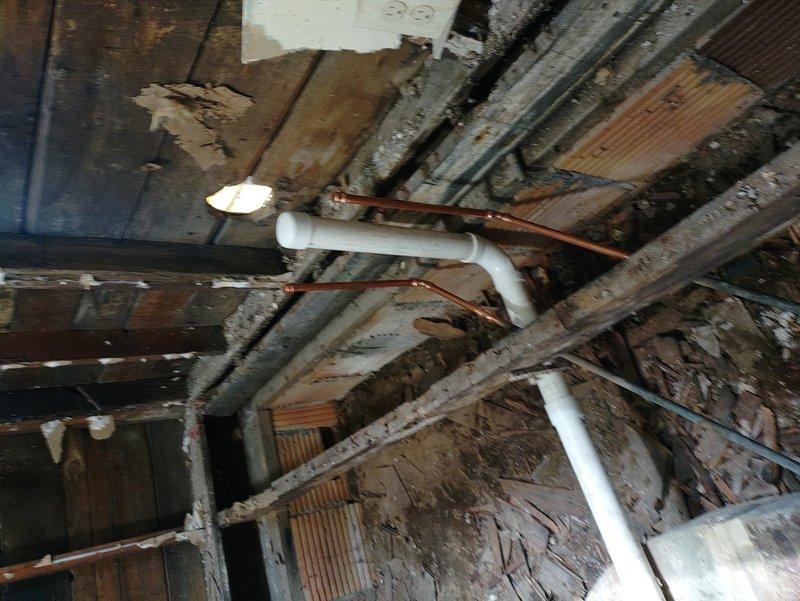 Completed plumbing repair in attic and crawl space areas involving copper pipe installation and replacement. Ordered necessary parts through warehouse with delivery coordination, managing backorder items until all components arrived. Installed new copper piping with proper support straps, hangers, and insulation foam where required, connecting to existing drainage lines and ensuring proper integration with PVC plumbing system and structural framework.