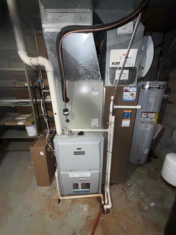 Completed MVP cooling maintenance visit on residential HVAC system, including Concord furnace with evaporator coil unit and outdoor condensing unit. Performed comprehensive system inspection, verified refrigerant lines and connections, checked condensate drainage, and confirmed proper operation of both indoor and outdoor equipment components.