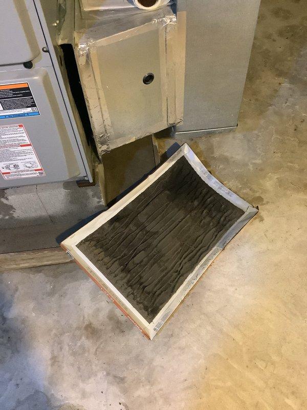 Responded to no cooling call on residential AC unit that had been inoperative for 2-3 days. Upon arrival, discovered severely restricted airflow due to heavily clogged air filter with excessive dust and debris accumulation. Removed and replaced dirty filter, restoring proper system airflow. Unit returned to normal cooling operation. Recommended regular filter maintenance to prevent future system failures.