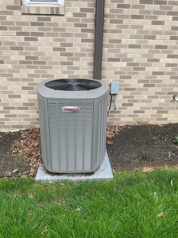 Completed MVP cooling maintenance visit on residential Lennox outdoor condensing unit. Performed standard preventive maintenance inspection, verified unit operational status, and documented equipment condition with photos showing clean exterior surfaces, intact components, proper pad placement, and adequate clearance from building and landscaping.