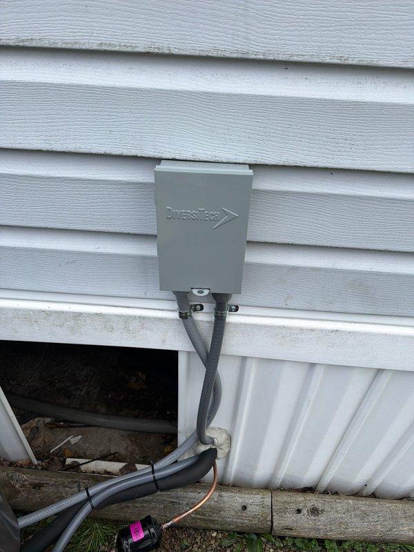 # HVAC Installation Report

Completed air conditioning system installation on mobile home structure. Installed new outdoor condensing unit with proper electrical connections, including 25-amp fused disconnect and HVAC contactor with appropriate wire terminations. Mounted Diversitech electrical disconnect box on exterior wall per manufacturer specifications and local electrical code requirements. Verified all copper terminal connections were secure and properly torqued. Tested system operation and confirmed proper electrical function of all components. Installation included proper conduit routing and weatherproof connections to protect electrical components from outdoor elements.