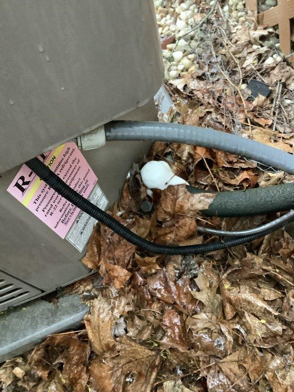 Responded to service call for frozen air conditioning unit at residential property. Upon arrival, found evaporator coil completely iced over, requiring thaw time before diagnostic procedures could be performed. After unit thawed, conducted refrigerant charge assessment and confirmed system was low on refrigerant. Inspected outdoor condensing unit and refrigerant line set for visible signs of leaks or damage. Observed heavily contaminated air filter with significant dust and debris accumulation, which can restrict airflow and contribute to freezing conditions. Provided customer with quote for refrigerant recharge service on older residential system.