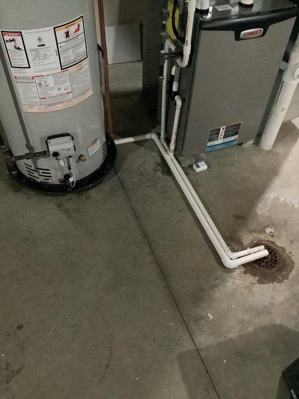 Replaced a leaking 2017 Rheem 50-gallon water heater with a new Bradford White 50-gallon unit featuring a 6-year manufacturer warranty. Installed a drain pan with discharge line to floor drain, rebuilt hot and cold water lines with new copper drops, tied into existing CPVC with appropriate transition adapters, installed new shut-off valve on cold water line, mounted new expansion tank, and capped the drop from the original expansion tank location.