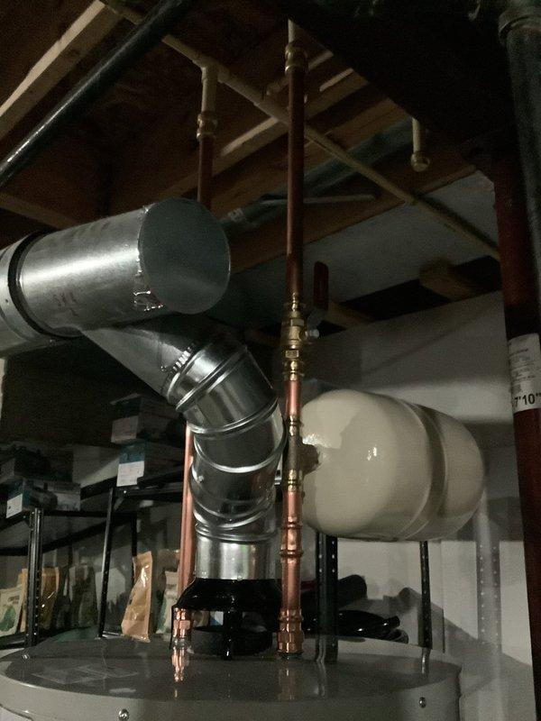 Replaced a leaking 2017 Rheem 50-gallon water heater with a new Bradford White 50-gallon unit featuring a 6-year manufacturer warranty. Installed a drain pan with discharge line to floor drain, rebuilt hot and cold water lines with new copper drops, tied into existing CPVC with appropriate transition adapters, installed new shut-off valve on cold water line, mounted new expansion tank, and capped the drop from the original expansion tank location.