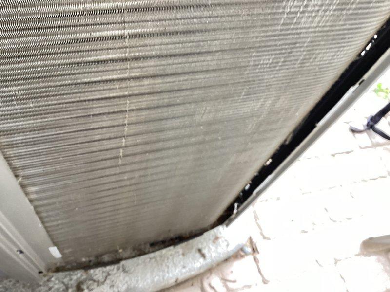 Completed MVP cooling maintenance visit on 8-year-old system. Inspected evaporator coil assembly and found moderate dust and debris accumulation between fins with visible staining along insulation line. Examined return air filter which showed significant dust buildup on horizontal louvers, indicating need for replacement to maintain proper airflow and system efficiency.
