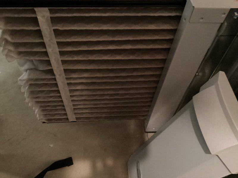 Completed MVP cooling maintenance visit on 8-year-old system. Inspected evaporator coil assembly and found moderate dust and debris accumulation between fins with visible staining along insulation line. Examined return air filter which showed significant dust buildup on horizontal louvers, indicating need for replacement to maintain proper airflow and system efficiency.