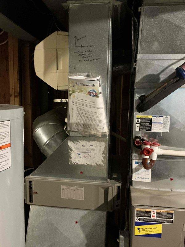 Completed HVAC estimate for residential furnace and air conditioning system replacement in basement utility area. Evaluated existing gray metal furnace unit with connected ductwork, air handler with curved galvanized metal supply duct, and assessed compatibility with current infrastructure including water heater placement. Provided customer with pricing options for complete furnace and AC replacement versus AC unit only replacement, documenting equipment specifications, installation requirements, and system configuration for quote preparation.