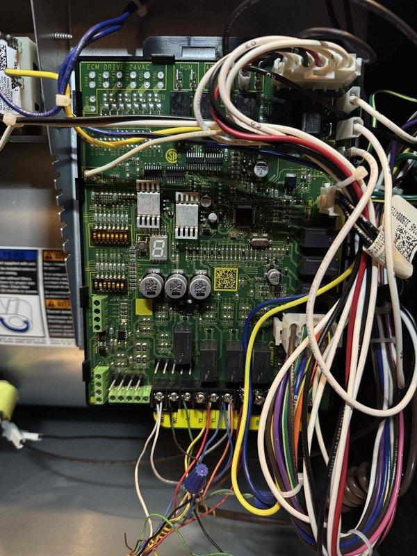 Completed scheduled preventive maintenance on residential air conditioning system. Performed comprehensive electrical diagnostics using digital multimeter to verify proper voltage and amperage readings across system components. Inspected and tested ECU drive board and main control circuit board, confirming all electronic components, capacitors, and integrated circuits functioning within normal parameters. Verified proper wiring connections at terminal blocks and checked all control voltages at 24VAC. All system measurements recorded within manufacturer specifications and unit operating efficiently.