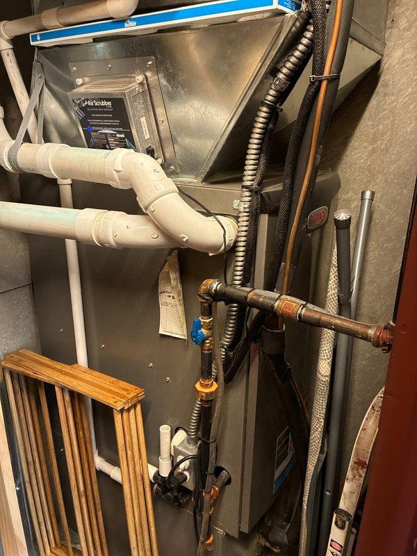 Completed scheduled BS-MVP heating maintenance visit on residential HVAC system. Performed comprehensive inspection of air handler unit, verified proper operation of all mechanical components, and examined control board including flame sense circuit and DIP switch configurations. Documented system condition with photographs showing furnace installation, refrigerant lines, condensate drainage, and control board components all functioning within normal parameters.