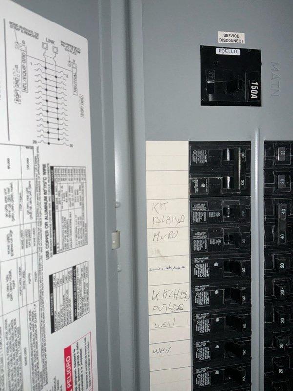Conducted on-site electrical assessment for generator installation estimate. Documented existing electrical infrastructure including service disconnect panel and PDB110 distribution panel with multiple circuit breakers. Photographed current panel configuration, wiring diagrams, and circuit labeling to evaluate system capacity and determine integration requirements for proposed generator. Created preliminary layout sketch noting key circuits including kitchen island microwave, outlets, and well pump to assess critical load requirements for generator sizing and transfer switch specifications.