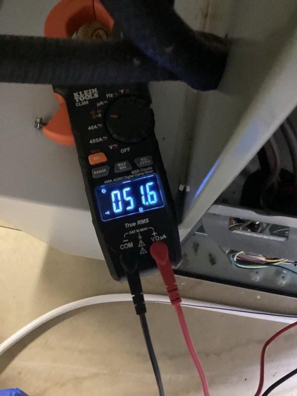 Completed heating system tune-up and performance evaluation. Performed combustion analysis on natural gas furnace using Bacharach Fyrite InTech analyzer, confirming optimal operating parameters with 98.4% efficiency, O₂ at 9.3%, CO at 13 ppm, and CO₂ at 6.5%. Measured electrical amperage draw at 5.16 amps using digital clamp meter to verify proper motor operation and system performance within manufacturer specifications.