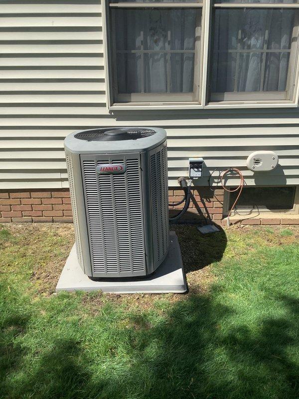 Completed installation of Lennox air conditioning system including outdoor condensing unit and indoor evaporator coil with air handler. Installed outdoor condenser on concrete pad with proper clearances from structure, established refrigerant line connections using copper tubing, and completed electrical wiring with disconnect box mounted to exterior wall. Interior installation included mounting air handler unit in utility room, connecting supply and return ductwork, installing condensate drain lines with PVC piping, and making all necessary refrigerant line connections between indoor and outdoor components. Verified all electrical connections, tested system operation, and confirmed proper drainage.