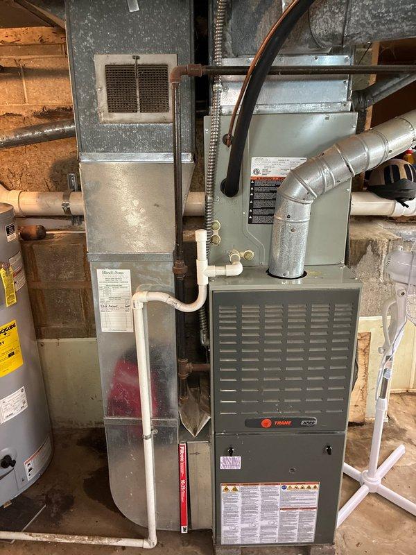 Completed cooling maintenance on residential HVAC system including both indoor Trane furnace/air handler unit located in basement and outdoor condenser unit. Performed standard tune-up procedures, system inspection, and documentation; confirmed system operating properly with no issues identified.