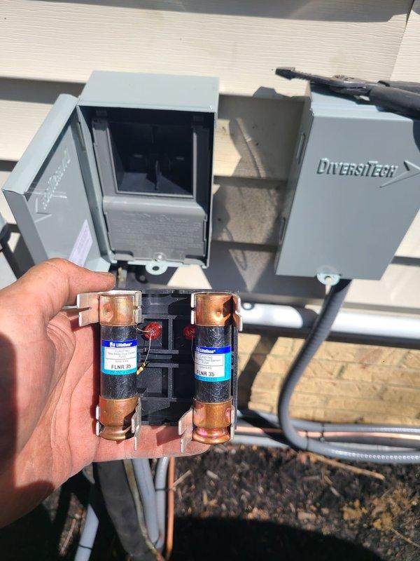 Completed installation of two Lennox outdoor condensing units with corresponding evaporator coils for a dual-zone residential HVAC system. Units were positioned side by side on vibration-dampening rubber pads against the exterior wall, with copper refrigerant lines and electrical conduits properly routed and secured to the building. Installed DiversiTech disconnect boxes with appropriate fusing for each unit to meet electrical code requirements. All refrigerant lines were brazed, insulated, and tested for leaks. System was evacuated, charged to manufacturer specifications, and tested for proper operation. Installation includes proper drainage provisions and meets all applicable building and electrical codes.