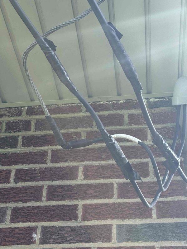 # Central Air Conditioner Repair

Responded to service call for non-operational central air conditioning system. Upon arrival, performed comprehensive system diagnostic to identify cause of failure. Inspected outdoor condensing unit and traced refrigerant lines along exterior brick wall, noting proper insulation and line set installation.

Accessed indoor air handler unit and identified failed electrical connection at compressor contactor assembly. Found deteriorated wire connection with visible oxidation on copper terminals and loose wire nut causing intermittent power loss to compressor circuit. Removed faulty connector and stripped back damaged wire ends to expose clean copper.

Installed new wire nut connection and secured all electrical terminations to manufacturer specifications. Verified proper voltage at contactor coil and confirmed 24V control circuit functionality. Inspected compressor wiring harness for additional signs of wear or damage.

Tested system operation through com