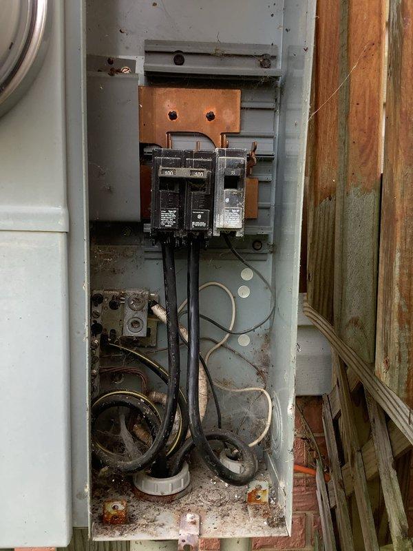 Responded to electrical outage affecting approximately two-thirds of modular home that had been vacant for three and a half months. Upon arrival, conducted comprehensive evaluation of electrical system to identify cause of power loss suspected to be related to rodent damage from mouse infestation.

Performed thorough inspection of main electrical panel and discovered extensive corrosion and water damage throughout the enclosure. Panel exhibited significant rust accumulation on bottom surfaces and lower portions, with corrosion extending to terminal connections and internal components. Found degraded and discolored wiring with compromised insulation showing signs of aging and environmental exposure. Observed disorganized and tangled wiring in lower section of panel with accumulated debris and particulate matter.

Documented conditions with photographs showing corroded bussing connections, deteriorated circuit breakers, and moisture-damaged electrical components. Panel condition indicate