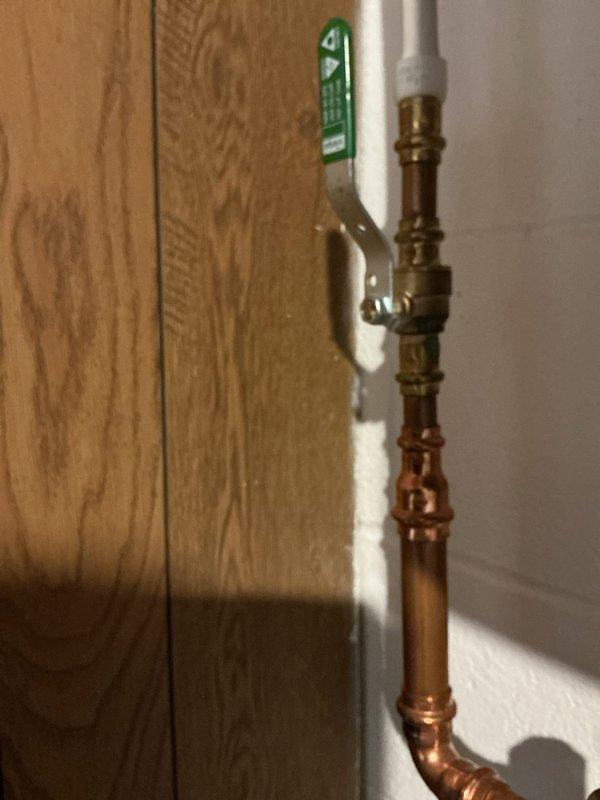 Performed routine maintenance flush on a 3-4 year old electric tanked water heater. Drained sediment buildup from tank bottom through drain valve, flushed system with cold water supply until discharge ran clear, and inspected all plumbing connections including copper supply lines and shut-off valves for proper operation. Verified temperature and pressure relief valve functionality, checked anode rod condition, and confirmed water heater was heating properly after refilling. All components operating within normal parameters with no leaks detected at connections or fittings.
