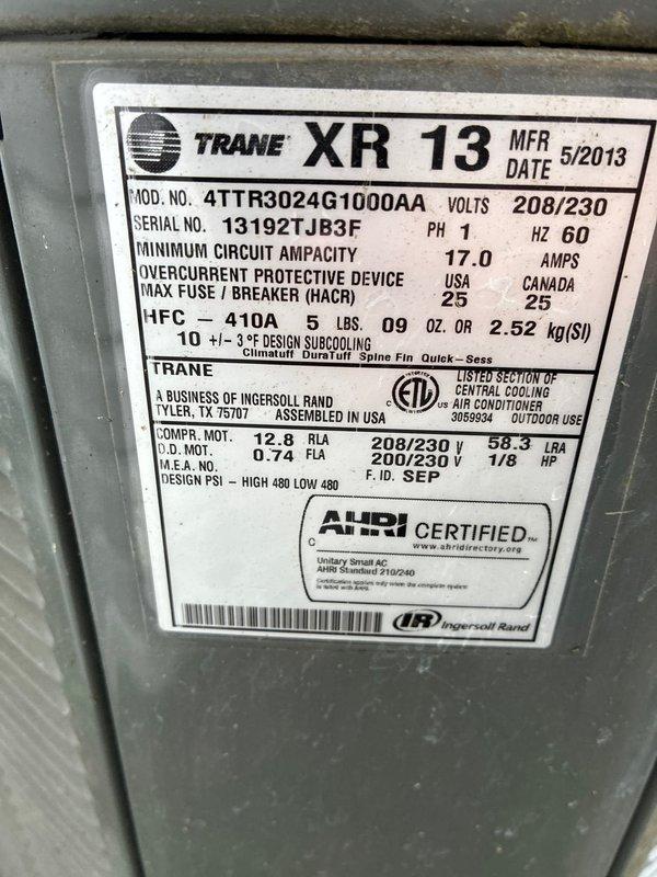 Completed preventive maintenance on Trane XR13 air conditioning system, model 4TTR3024G1000AA. Performed comprehensive inspection of outdoor condensing unit and indoor evaporator coil assembly, verified refrigerant charge of R-410A, checked electrical connections and specifications against manufacturer nameplate data, and documented equipment condition through photographic records. All components found operating within normal parameters.