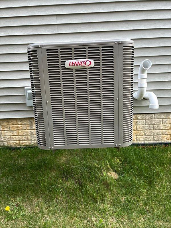 Completed preventive maintenance cooling visit on 5-year-old Lennox outdoor condensing unit. Removed access panel to inspect electrical components including dual capacitors, verified all wire connections secure, and tested system operation. Unit exterior in good condition with no visible damage or deterioration, all louvers intact and allowing proper airflow.