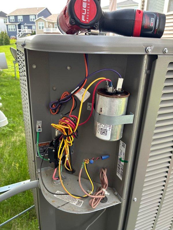 Completed preventive maintenance cooling visit on 5-year-old Lennox outdoor condensing unit. Removed access panel to inspect electrical components including dual capacitors, verified all wire connections secure, and tested system operation. Unit exterior in good condition with no visible damage or deterioration, all louvers intact and allowing proper airflow.