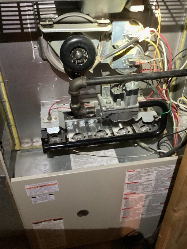 Completed comprehensive air conditioning tune-up on 10-year-old system. Performed standard maintenance inspection including visual examination of internal components, blower motor assembly, gas valve, electrical connections, and control board wiring. All mechanical and electrical systems photographed and found to be operational with no immediate service requirements identified.