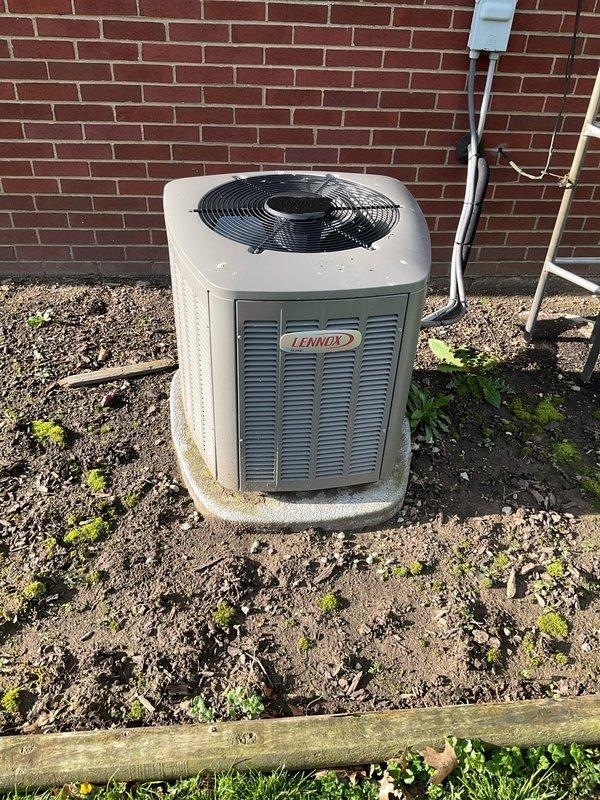 Performed comprehensive cooling season tune-up and maintenance on 6-year-old Lennox air conditioning system. Completed full system inspection, cleaning, and performance testing of outdoor condensing unit, verified proper refrigerant levels, checked electrical connections, and documented equipment condition with photos showing unit in operational status on concrete pad with adequate clearance from structure.