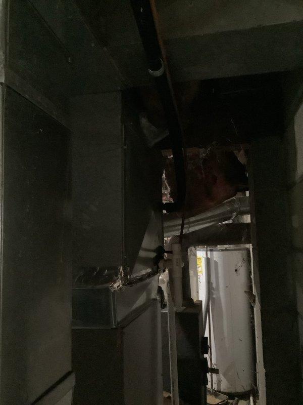 Completed recurring maintenance visit on HVAC system. Upon inspection, discovered severe lint and debris accumulation within air handler cabinet, which was removed to restore proper airflow and prevent potential system efficiency issues or fire hazards. Inspected ductwork, water heater, and associated mechanical components in utility room to ensure all equipment operating within normal parameters.