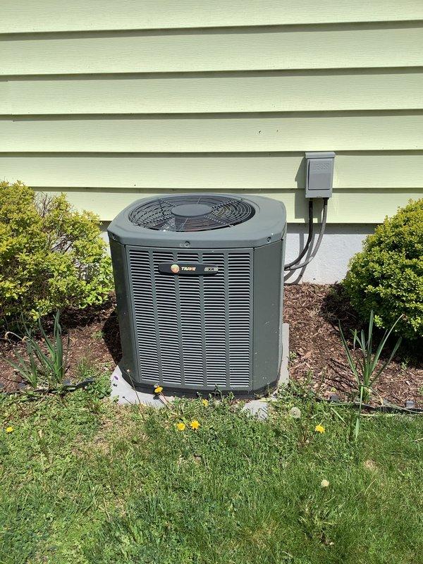 Responded to service call for Trane air conditioning system over 10 years old with inadequate cooling performance, unable to maintain temperature below 70 degrees. Performed diagnostic evaluation of outdoor condenser unit and indoor air handler system to identify cause of reduced cooling capacity and recommend necessary repairs or system maintenance.