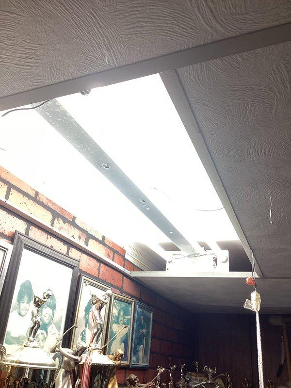 Responded to service call for non-functional fluorescent light fixture in residential interior space. Upon arrival, assessed the skylight-mounted fluorescent fixture and determined the ballast had failed. Replaced the defective ballast with a new compatible unit, tested the fixture to confirm proper operation, and verified all connections were secure. The fluorescent light is now functioning correctly and providing adequate illumination to the space.