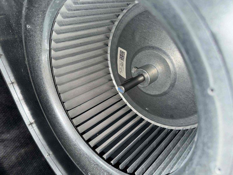 Performed comprehensive annual maintenance on a twelve-year-old air conditioning system. Conducted complete system inspection including blower assembly evaluation, where the squirrel cage fan wheel and motor hub were accessed and inspected for proper operation. The centrifugal blower wheel showed normal dust accumulation on the curved blades consistent with operational use. Verified motor shaft alignment and checked blower wheel for balance and secure mounting. Inspected interior components of the air handler, documenting the condition of the fan assembly and housing. All mechanical components were found to be intact with no signs of damage or unusual wear. System operational parameters confirmed within normal range for a unit of this age.