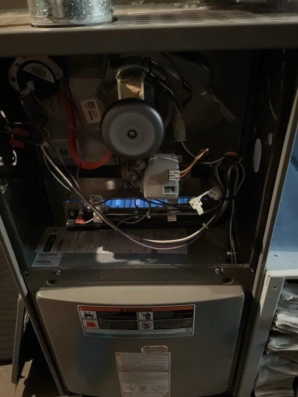 Completed routine MVP furnace maintenance visit and inspection. Accessed interior components, verified blower motor assembly operation, inspected all electrical connections and wiring, and confirmed gas burner assembly firing properly with blue flames visible. All mechanical and safety systems functioning within normal parameters.